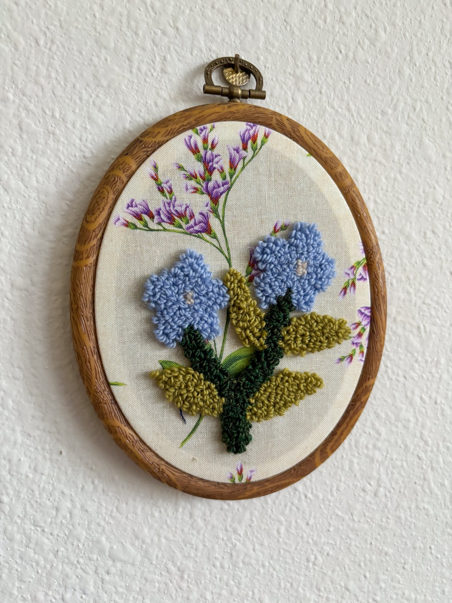 Forget me not on Purple Flowers