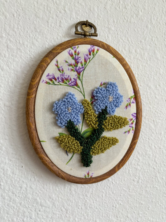 Forget me not on Purple Flowers