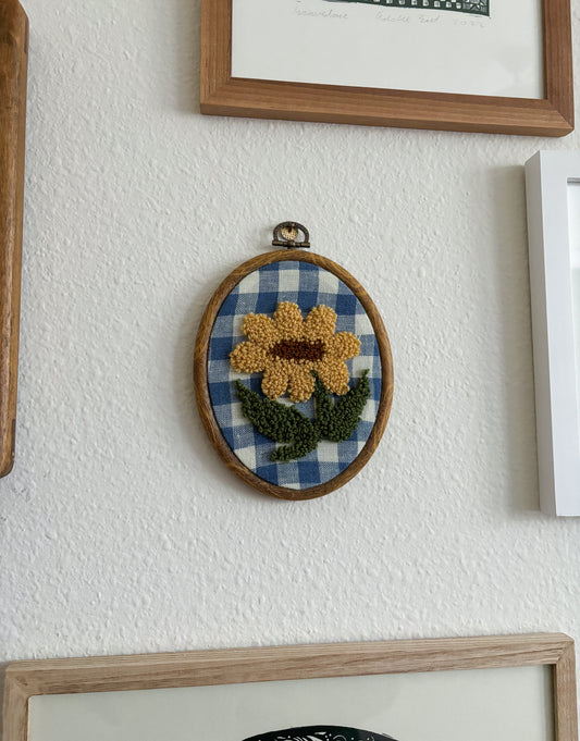 Sunflower on Blue Checkered Fabric